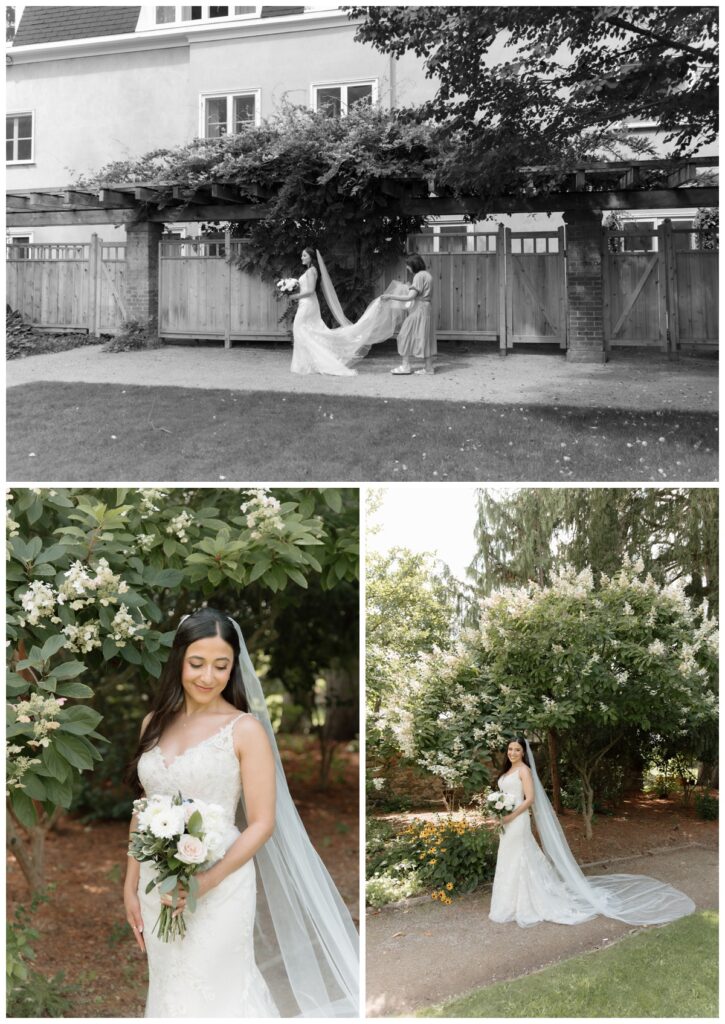 Bride with her long veil beside ivy-covered walls in the Langdon Hall gardens